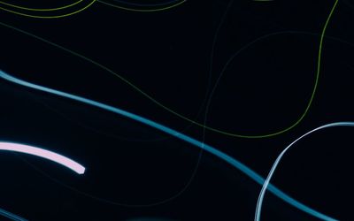 Abstract glowing lines over a workspace